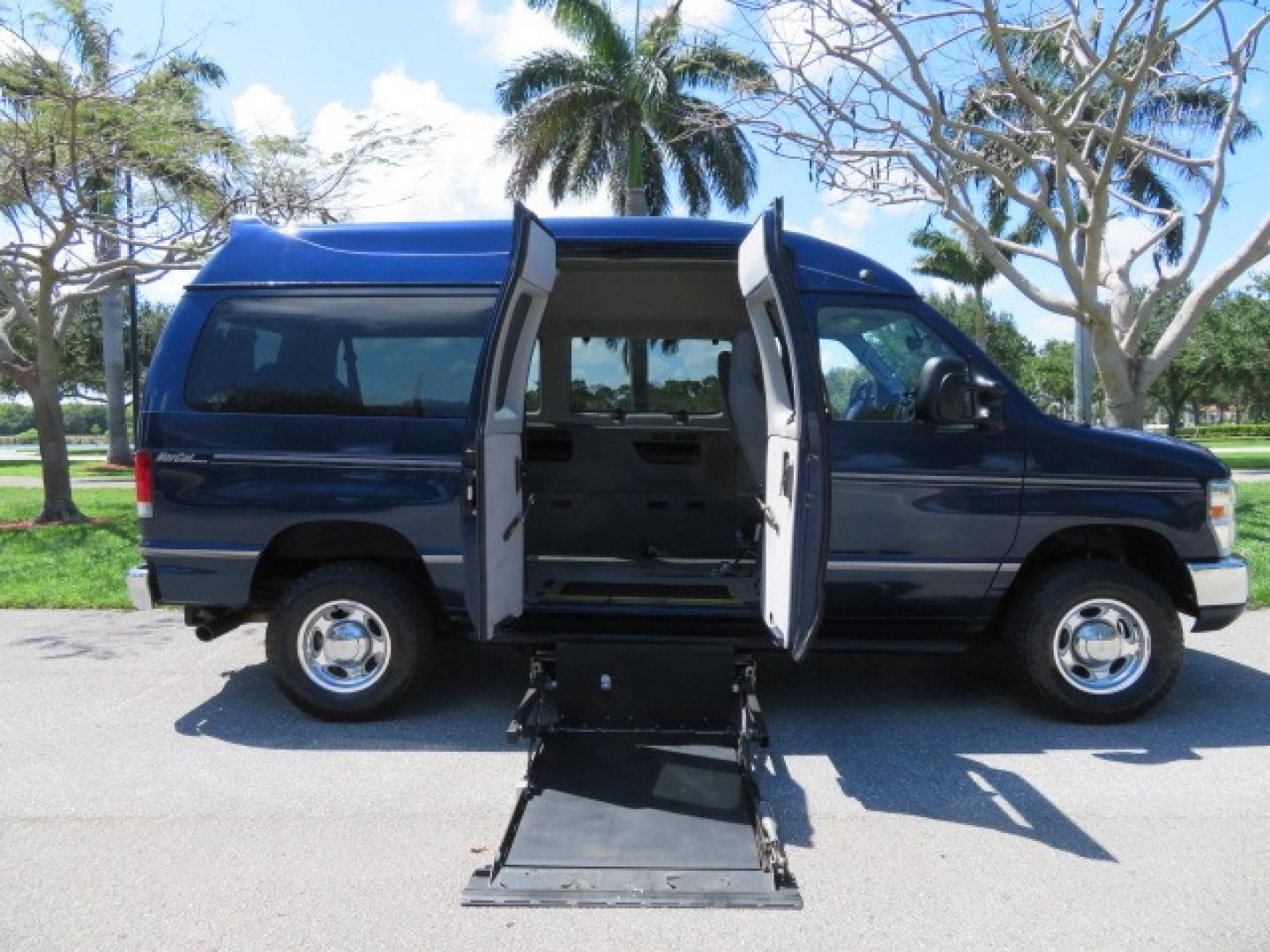 2011 Dark Blue /Gray Ford E-Series Wagon E-350 XLT Super Duty (1FBNE3BS4BD) with an 6.8L V10 SOHC 20V engine, located at 4301 Oak Circle #19, Boca Raton, FL, 33431, (954) 561-2499, 26.388861, -80.084038 - You are looking at a Gorgeous 2011 Ford Econoline E350 XLT Norcal Max High Top Handicap Wheelchair Conversion Van with 6.8L V10, 15K Original Miles, 9 Inch Lowered Floor, Braun UVL Side Entry Wheelchair Lift, Remote Control Power Side Entry Doors, Expanded Side Entry Doors, Q Straint Tie Down, Syste - Photo#43